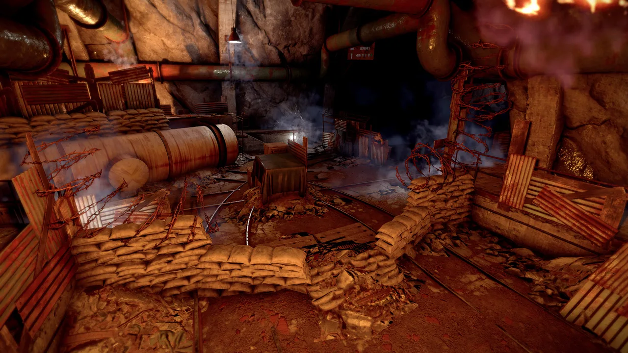 Подземный зал военных тоннелей Rust: баррикады из мешков с песком, колючая проволока и рельсы вагонетки