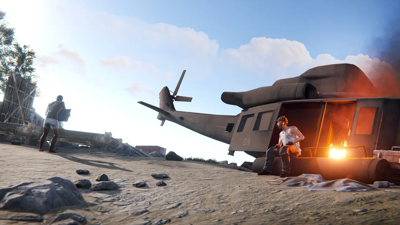 Новичок на обучающем острове Rust идёт к разбитому вертолёту, у которого сидит персонаж-наставник с гарнитурой