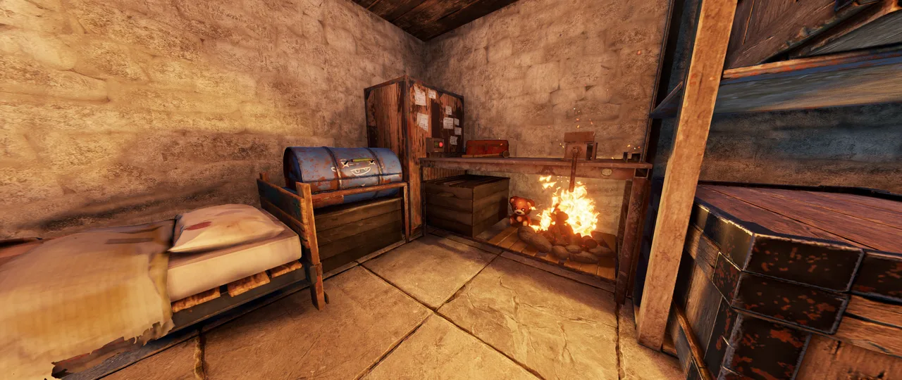 Закрытая комната каменной базы в Rust: кровать, бочка-ящик, шкаф с записками, верстак и костёр под ним
