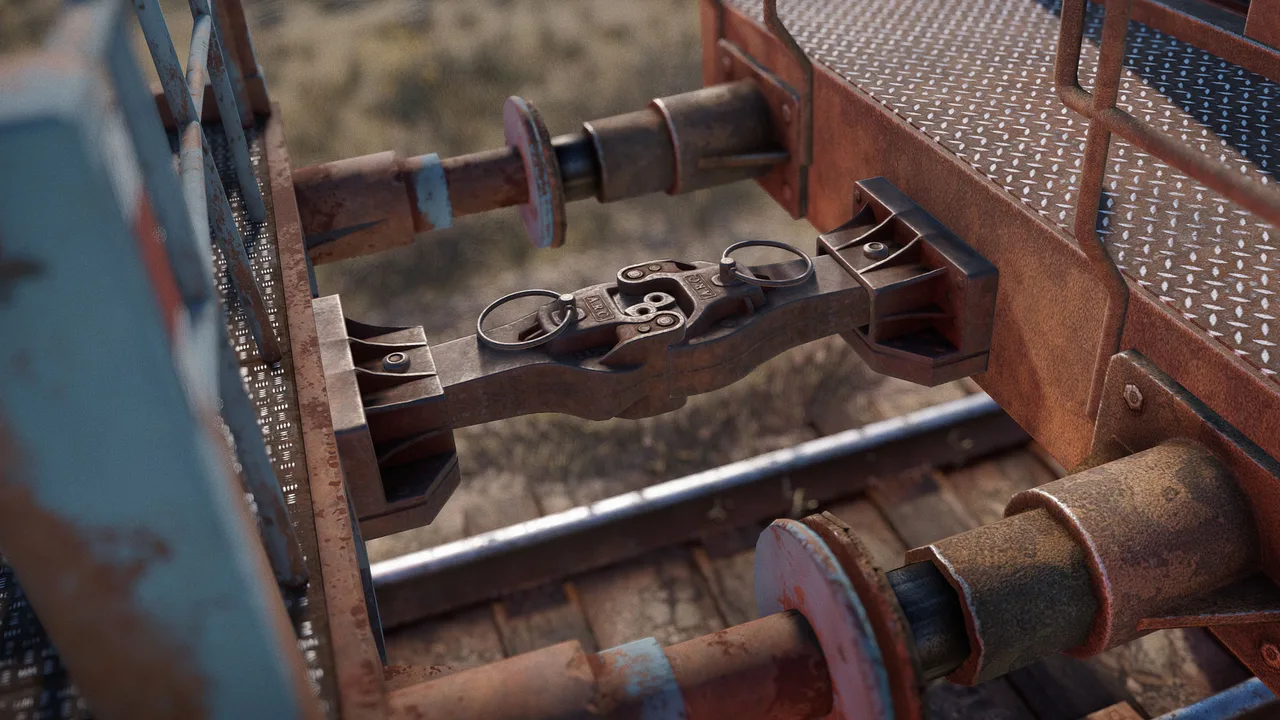 Автосцепка между двумя вагонами Rust крупным планом: замок с кольцами, буферы и рельсы под составом